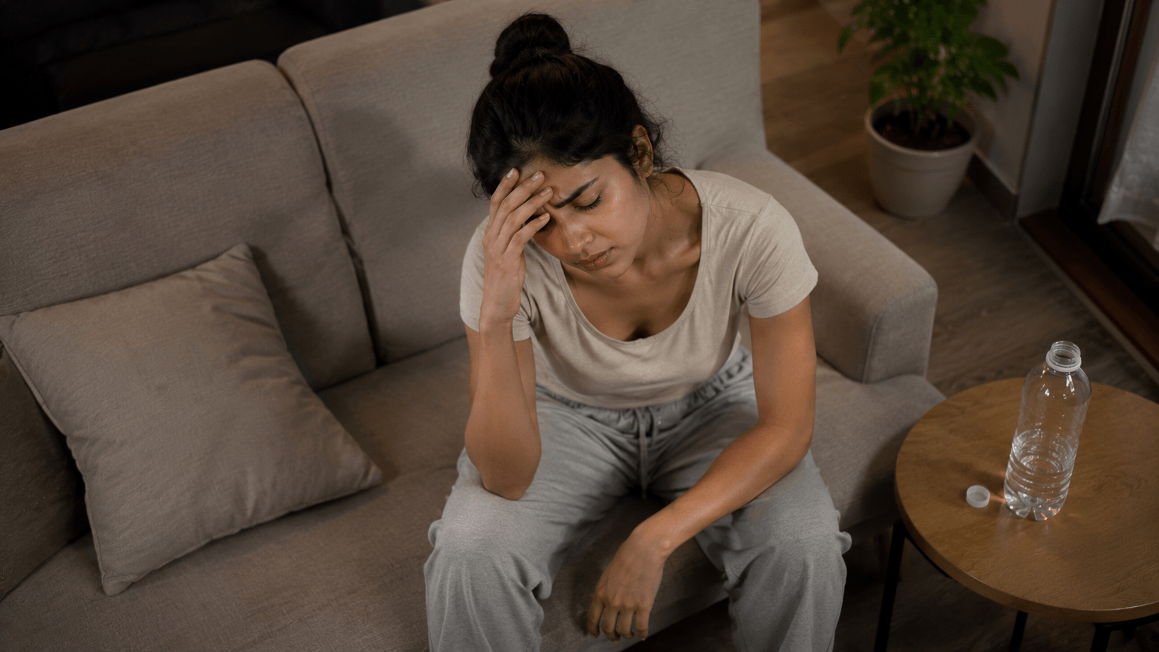How Stress and Dehydration Cause Constipation young girl feeling stressed and dehydrated causing severe chronic constipation